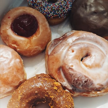 Donut King - The one with the red in the middle is the guava one, and bottom is the butter finger - Donuts Near Me - Winter Park, Florida