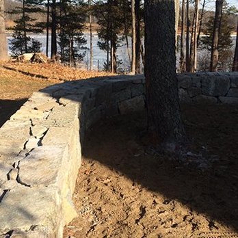 Great Cove Landscaping - a stone wall along the shore of a lake - Tree Services Near Me - Newmarket, New Hampshire Great Cove Landscaping - a stone wall along the shore of a lake - Tree Services Near Me - Newmarket, New Hampshire