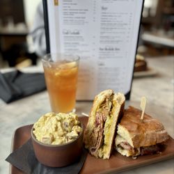 The Golden Pig - Delicious Cuban sandwich with homemade potato salad.