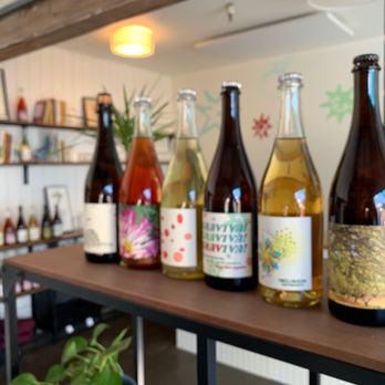 Tilted Shed Ciderworks - a row of wine bottles - Cideries Near Me - Windsor, California Tilted Shed Ciderworks - a row of wine bottles - Cideries Near Me - Windsor, California