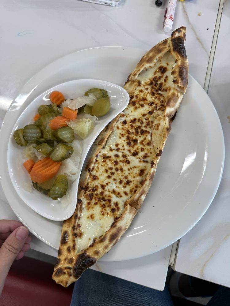 Pino’s Elixir Cafe Logo