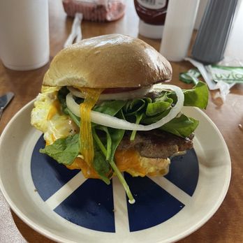 Gypsy Joynt - Breakfast bun with egg, sausage and fresh spinach - Cafes Near Me - Galveston, Texas