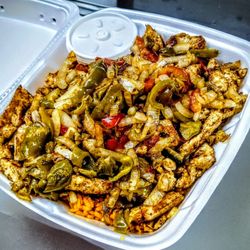 Prince Fried Chicken - Grilled chicken , seasoned, and loaded with grilled onions and sweet peppers over fluffy yellow rice. signature white sauce on the side.