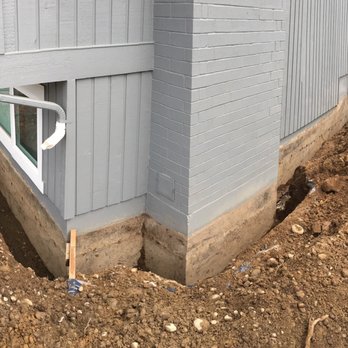 Wu Construction - Before view with digging work around the house. - Waterproofing Near Me - Seattle, Washington Wu Construction - Before view with digging work around the house. - Waterproofing Near Me - Seattle, Washington