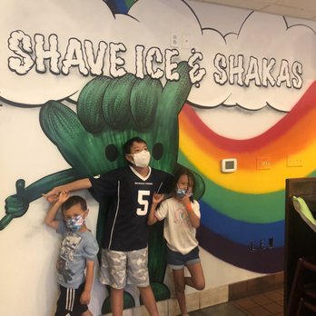 Wailua Shave Ice - Cute wall, but we can't figure out why the Shaka hand has hands hehehe - Shaved Ice Near Me - Kapaa, Hawaii