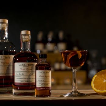Uncle Tim’s Cocktails - a glass of brandy and a half of an orange - Cocktail Bars Near Me - Denver, Colorado Uncle Tim’s Cocktails - a glass of brandy and a half of an orange - Cocktail Bars Near Me - Denver, Colorado