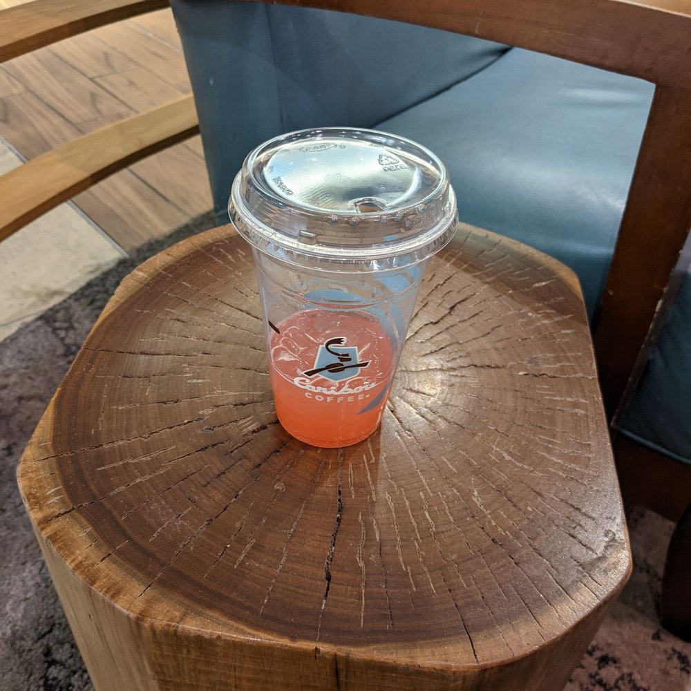 Caribou Coffee - I'm nearly done with my drink. I like the tree stump. - Coffee & Tea Near Me - St. Paul, Minnesota Caribou Coffee - I'm nearly done with my drink. I like the tree stump. - Coffee & Tea Near Me - St. Paul, Minnesota