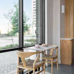 La Souq - Sip, relax, repeat. A cozy corner table bathed in natural light at LA SOUQ.