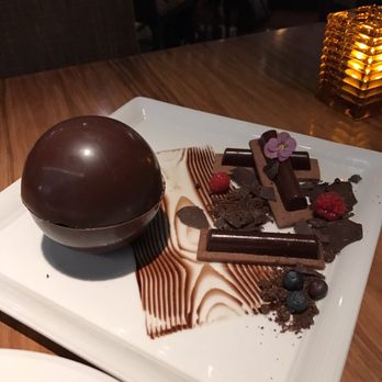Morimoto - Dessert. They poured fire over the chocolate ball. It melted revealing a marshmallow and chocolate ice cream center. - Japanese Near Me - Las Vegas, Nevada Morimoto - Dessert. They poured fire over the chocolate ball. It melted revealing a marshmallow and chocolate ice cream center. - Japanese Near Me - Las Vegas, Nevada