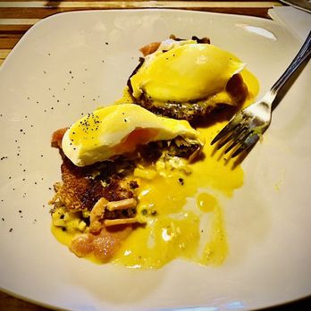 Kru Coffee - Land and sea Benedict. Slightly overcooked eggs on potato latke with a bit of salmon. - Coffee Roasteries Near Me - Glens Falls, New York Kru Coffee - Land and sea Benedict. Slightly overcooked eggs on potato latke with a bit of salmon. - Coffee Roasteries Near Me - Glens Falls, New York