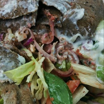 Greek Style Chicken - The gyro salad with all the fixings partially eaten. - Greek Near Me - Fallbrook, California