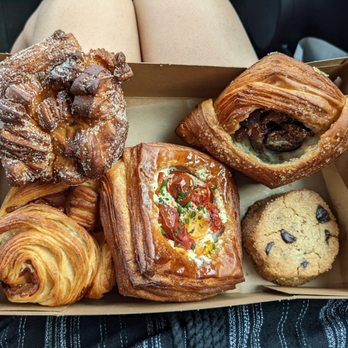 Moonbelly Bakery - From top left Cardamom Bun, Fig and Cream, Choco Chip Shortbread, Tomato and Goat Cheese, Ham & Cheese - Bakeries Near Me - Sacramento, California Moonbelly Bakery - From top left Cardamom Bun, Fig and Cream, Choco Chip Shortbread, Tomato and Goat Cheese, Ham & Cheese - Bakeries Near Me - Sacramento, California