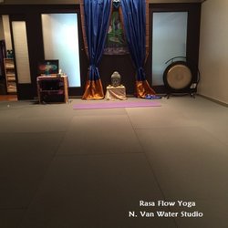 Rasa Flow Yoga - Studio space with yoga flooring.