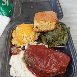Meatloaf with mashed potatoes,  mac n cheese, greens and cornbread. Also had the peach cobbler ( not shown)
