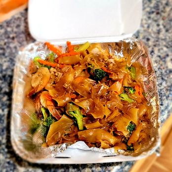 Thai Table Time - a container of food on a table - Thai Near Me - Oceanside, California Thai Table Time - a container of food on a table - Thai Near Me - Oceanside, California