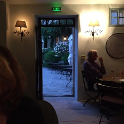 Bistro 40 K - The view from inside out to the terrace with rose bushes.