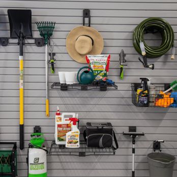 Garagify - a garage wall with tools hanging on it - Cabinetry Near Me
