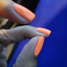 Bumpy edges and drip of polish on the sides of my fingertips