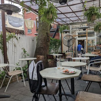 Cafe Alula - a patio with tables and chairs - Cafes Near Me - Brooklyn, New York