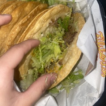 Filiberto's Mexican Food - a hand holding a taco - Mexican Near Me - Phoenix, Arizona Filiberto's Mexican Food - a hand holding a taco - Mexican Near Me - Phoenix, Arizona