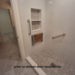 The Tile Shop - Shower tile: walls, niche and shower base. Flooring tile extending from the bath to the primary closet.