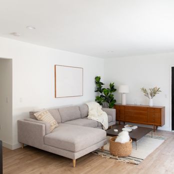 Ultimate Floors - a living room with a couch and a coffee table - Flooring Near Me - Los Angeles, California Ultimate Floors - a living room with a couch and a coffee table - Flooring Near Me - Los Angeles, California