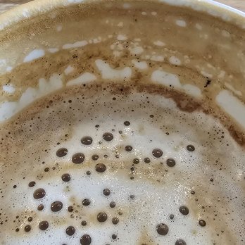Good Source Coffee - You can see the burn coffee on the wall of the cup. Was so bitter. I don't think I have ever seen grounds on a latte - Coffee & Tea Near Me - Escondido, California