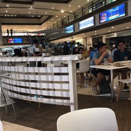 Located in the middle of the mall on the second floor.