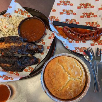 Phil's BBQ - Famous must have cornbread. 3 beef rib dinner plate w Mac and beans, and side of must have sausages - Barbeque Near Me - San Diego, California Phil's BBQ - Famous must have cornbread. 3 beef rib dinner plate w Mac and beans, and side of must have sausages - Barbeque Near Me - San Diego, California