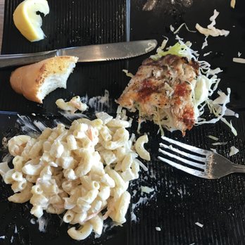 Fish's Wild - 2/3rds-eaten tilapia with garlic bread and mac salad - Seafood Near Me - Cupertino, California Fish's Wild - 2/3rds-eaten tilapia with garlic bread and mac salad - Seafood Near Me - Cupertino, California