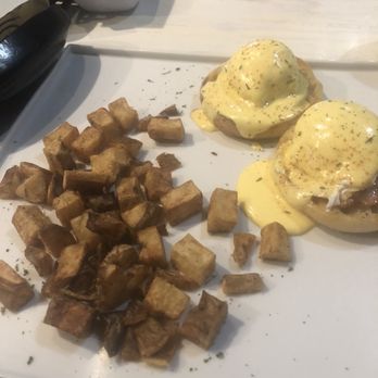 Native Cafe - Classic Eggs Benedict with a side of potatoes - American Near Me - Gulf Breeze, Florida Native Cafe - Classic Eggs Benedict with a side of potatoes - American Near Me - Gulf Breeze, Florida