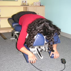 ADIO Chiropractic - Getting adjusted face down