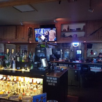 Rustic Lounge - a bar with a large screen tv - Dive Bars Near Me - Henderson, Nevada