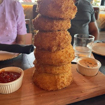 Haywire - Onion rings. Neat presentation and on an interesting metal branding stick. - New American Near Me - Houston, Texas Haywire - Onion rings. Neat presentation and on an interesting metal branding stick. - New American Near Me - Houston, Texas