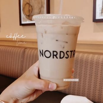 Nordstrom Ebar Artisan Coffee - a hand holding a cup of coffee - Coffee & Tea Near Me - Dallas, Texas