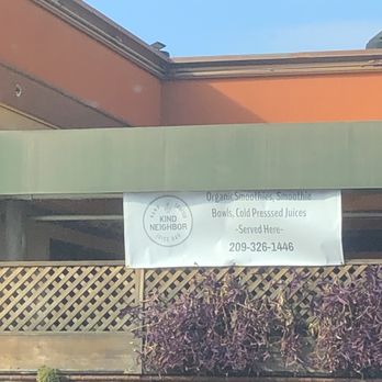 Kind Neighbor Juice Bar - a sign on the side of a building - Juice Bars & Smoothies Near Me - Merced, California Kind Neighbor Juice Bar - a sign on the side of a building - Juice Bars & Smoothies Near Me - Merced, California