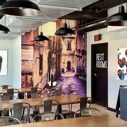 Spacious dining area, featuring new artwork by a local emerging artist