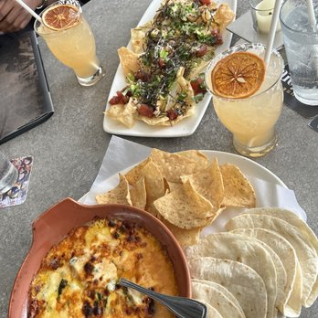Yard House - Miguel queso dip with chips and tortillas and Poke Nachos - Bars Near Me - Hallandale Beach, Florida Yard House - Miguel queso dip with chips and tortillas and Poke Nachos - Bars Near Me - Hallandale Beach, Florida