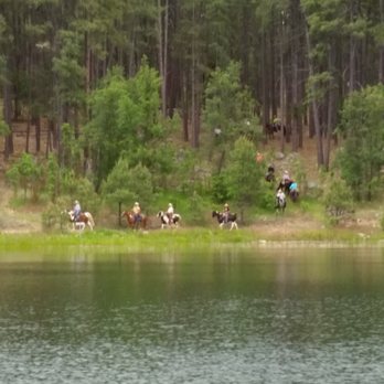 Goldwater Lake - Horseback riders leading their horses to the water! - Lakes Near Me - Prescott, Arizona