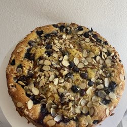 The Dainty Cow Bakery - 8-inch blueberry custard cake with slivered almonds.