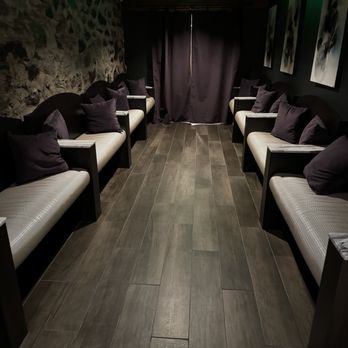 Loren - a row of couches in a dimly lit room - French Near Me - Spokane, Washington Loren - a row of couches in a dimly lit room - French Near Me - Spokane, Washington