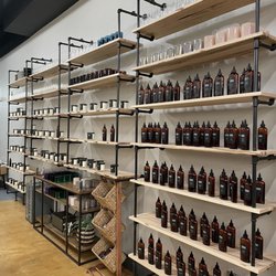 Wicks & Wax Studio - Wall of pre-poured candles