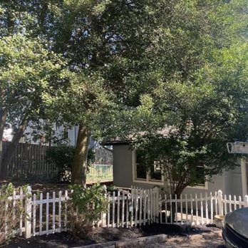 Rays Lawn and Gardening Services - a house with a white picketer fence - Landscaping Near Me Rays Lawn and Gardening Services - a house with a white picketer fence - Landscaping Near Me