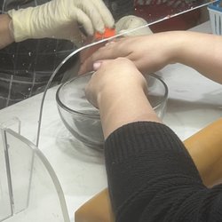 Amore Nail Spa - Her taking off my nails since it was clearly horrible