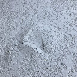 Morning after 1st rain.  Deck bubbled up and cracked.