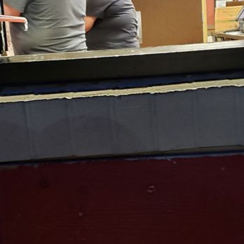 Burger King - a man and a woman sitting at a counter - Burgers Near Me - Marion, Iowa