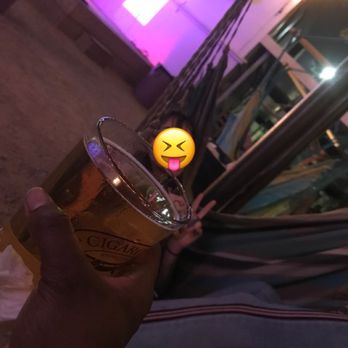 Axelrad - Lounge area with hammocks and a band playing in the background - Beer Gardens Near Me - Houston, Texas