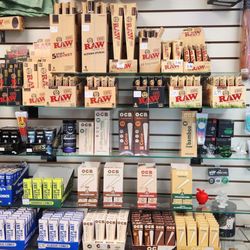 Waterbeds 'n' Stuff - Shelves of rolling papers and cones by RAW, OCB, and Vibes.