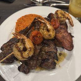 Lamb Chop Special w/ Shrimp. Sides Jollof Rice and Fried Sweet Plantains.