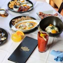 Highlander Bar and Grill - Brunch at the Highlander! You're sure to love a mimosa or loaded bloody Mary with our Turkish eggs, short rib hash, Shrimp-n-grits, or more!